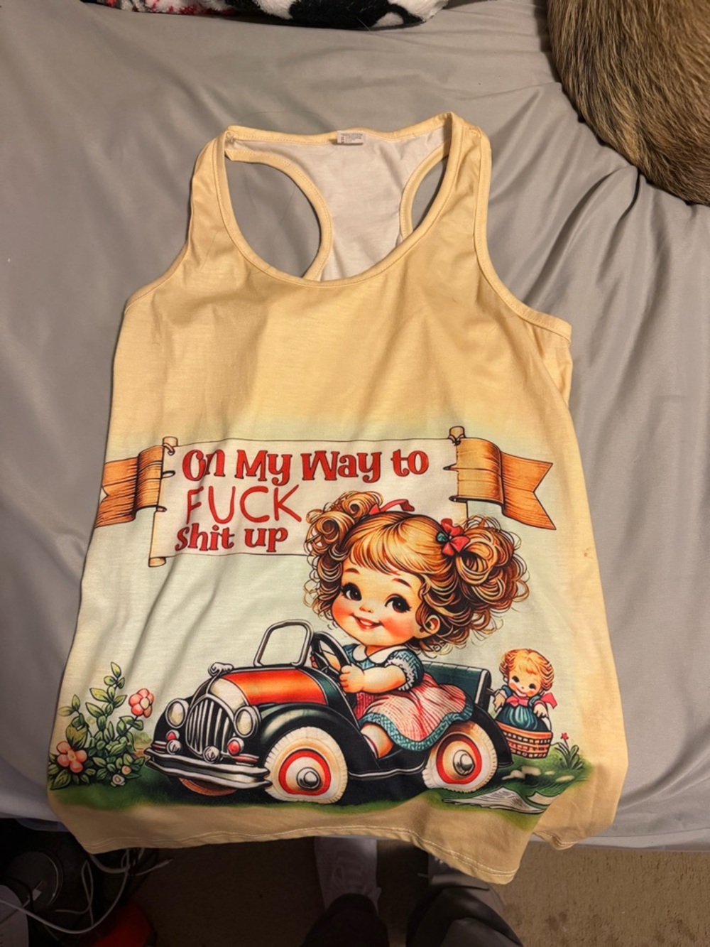Yellow Graphic Racerback Tank Top with Retro Driving Illustration